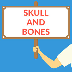 SKULL AND BONES. Hand holding wooden sign