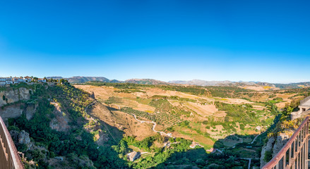 Fototapeta na wymiar Views to the valley of Serrania de Ronda Mountains from the viewpoint of the gardens of Tajo de Ronda in Ronda, Spain