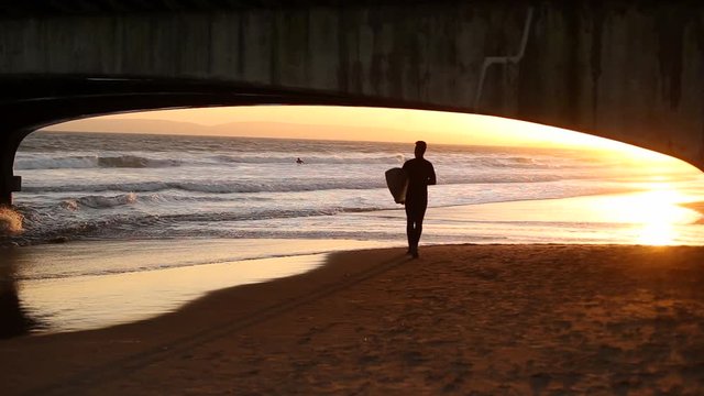 Surfer in Bournemouth Beach, England.