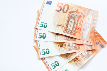 Close up on euro banknotes, white background