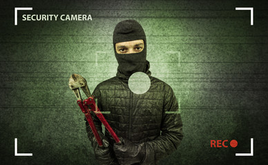 Naklejka premium Caught burglar by house camera in action.