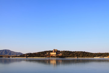 Tower of Buddhist incense and frozen Kunming lake