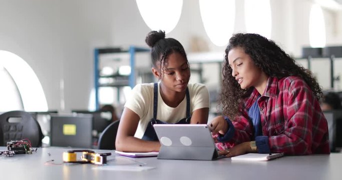 High school students working on robotics in class