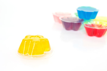 orange gelatin dessert on white background