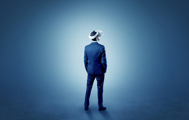 Fototapeta premium Businessman wearing vj glasse in an empty room with no wallpaper