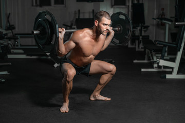 Male training with barbell, pumping legs