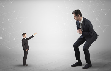 Small businessman aiming at a big businessman with connection and network concept
