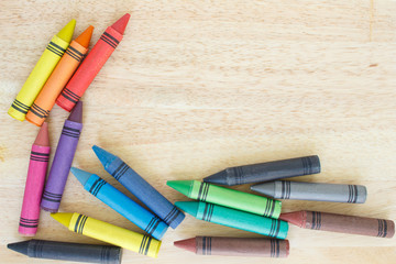 crayons drawing border multicolored on wooden background