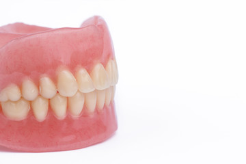 Full denture dentures close-up on white background