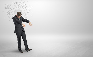 Sleeping sickness young businessman with questions, staffs in his head