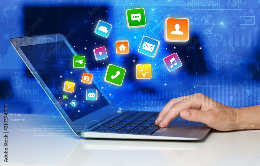 Poster Hand using laptop with bouncing colorful application and global reports and graphs concept
