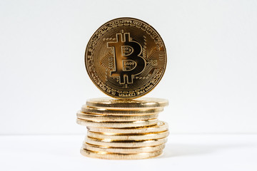 Golden bitcoin coin close up