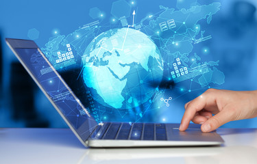 Hand using laptop with global reports and stock market change concept
