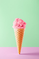 Ice cream cone isolated on a colorful background. Copy space. Vivid colors