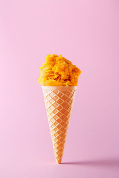 Ice cream cone isolated on a colorful background. Copy space. Vivid colors