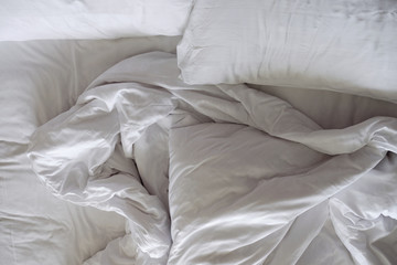 Messy Bed. White Pillow and Blanket in Bedroom, Relaxation and Comfortable Concept