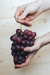 Bunch of grapes in hand