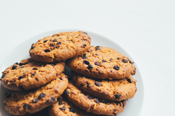 Chocolate cookies of on a plate on a white background