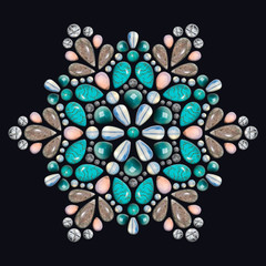 Creative layout of jewelry. The mandala is made of different gemstones on black background.