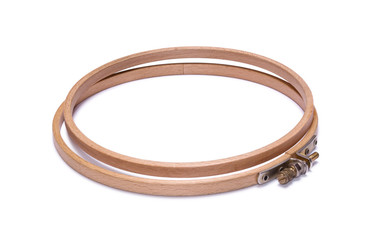 Wooden embroidery hoop isolated on white background © Ludaiv