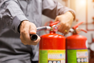 Engineer inspection Fire extinguisher in control room.