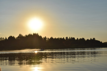 People  the scooter on the sunset background