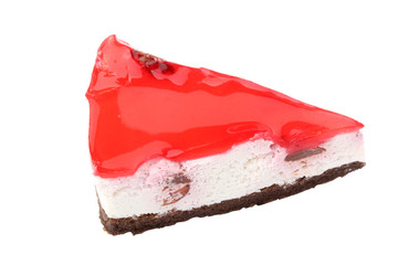 Piece of a white cake covered with red jelly isolated on a white background