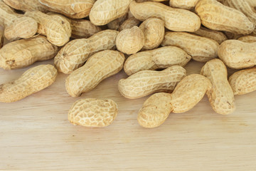 peanut in shell on wood background