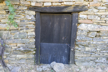 Old gate, wood and stone houses in the province of Zamora in Spain