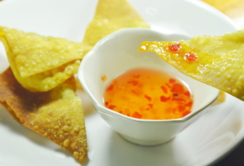 crispy fried dumpling paste dipping sweet chili sauce on plate