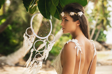 Portrait of young bride wearing beautiful white dress