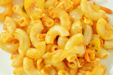 stir fried macaroni and egg with ketchup on plate
