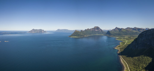 Fototapeta premium Aerial view towards the open sea, Fugloya, Lofotveggen or the Lofoten Wall and the horizon