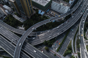 Aerial view of highway and overpass in city on sunny day