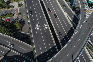 Aerial view of highway and overpass in city on sunny day