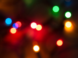 Detail of a Christmas lights abstract background on black