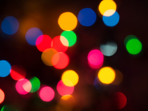Detail of a Christmas lights abstract background on black