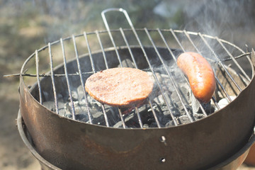 sausage grill is grilled on a grill