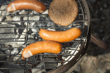 sausage grill is grilled on a grill
