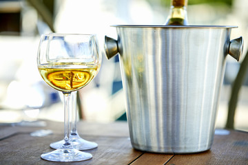 Pair of wineglasses against the yacht