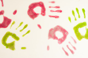 Lot of red and green color human handprint on white background