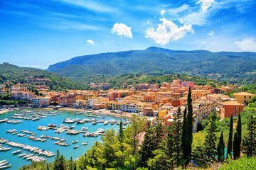 Panoramic aerial view of Porto Ercole town, Monte Argentario, Grosseto, Tuscany, Italy. Architecture and landmark of Porto Ercole and Italy. Tuscany is a region in central Italy - obrazy, fototapety, plakaty