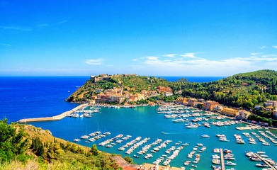 Panoramic aerial view of Porto Ercole town, Monte Argentario, Grosseto, Tuscany, Italy. Architecture and landmark of Porto Ercole and Italy. Tuscany is a region in central Italy