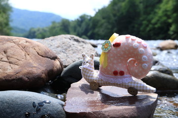 The image of the toy is a snail. Handmade.