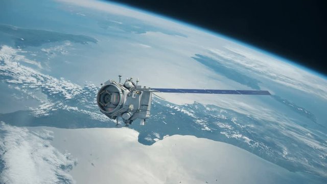 Global communication satellite orbiting earths atmosphere in space.