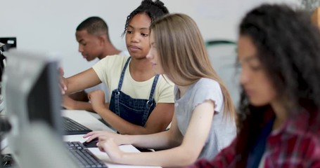 Students working together in a computer science class - Powered by Adobe