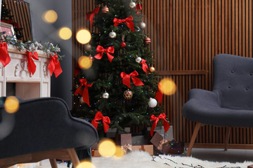 Stylish living room interior with decorated Christmas tree