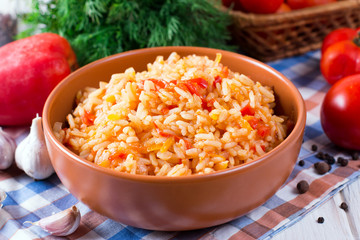 Fototapeta na wymiar Bowl full of rice with tomatoes