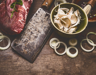 Raw meat with cleaver and spices on rustic wooden background, top view.