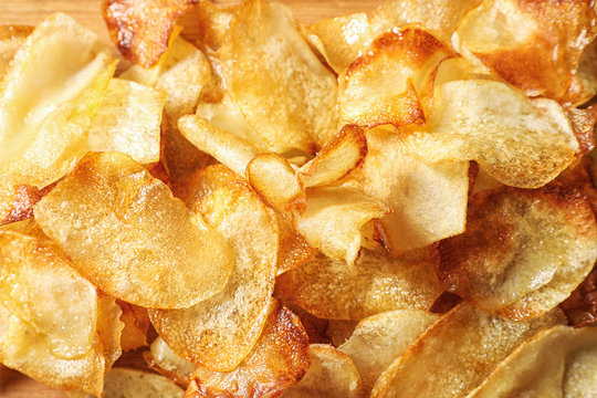Crispy potato chips as background